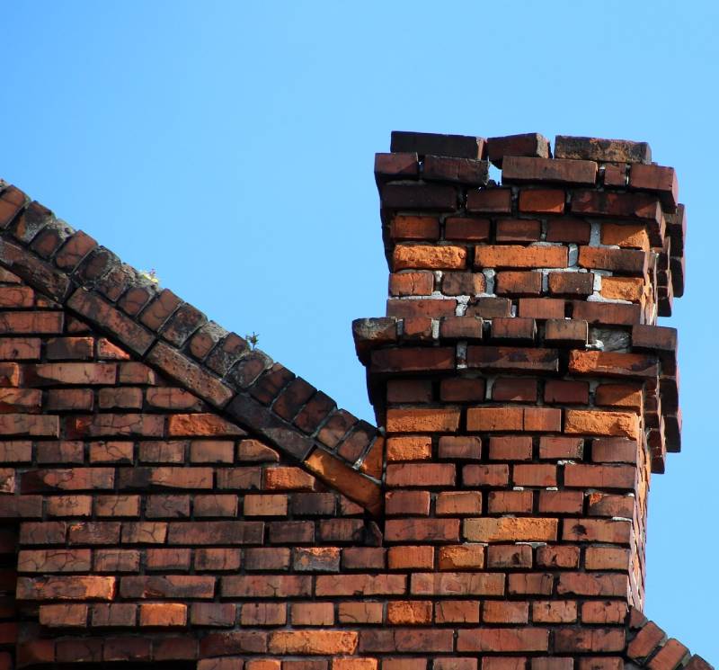 Signs Your Lathrup Village Home Needs a Chimney Inspection Damaged chimney on an Lathrup Village home showing cracks and missing mortar